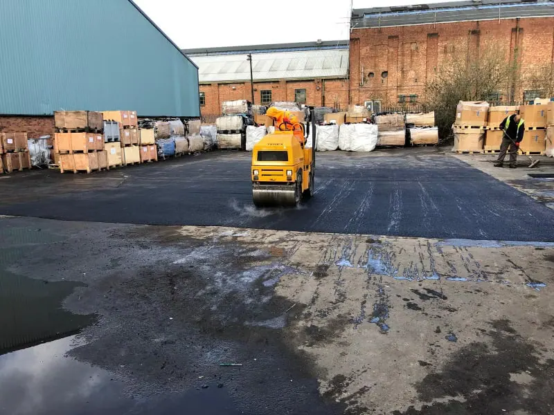 Industrial yard resurfacing with roller