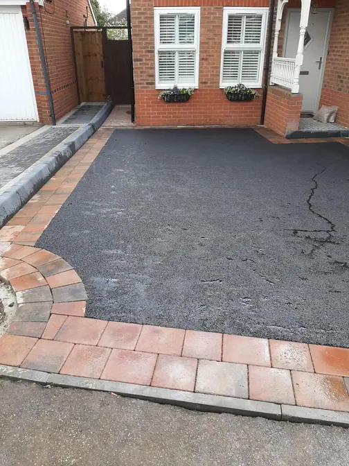 Tarmac forecourt with paved border