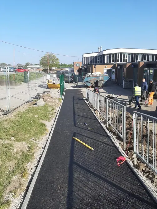New tarmac footpath beside railings