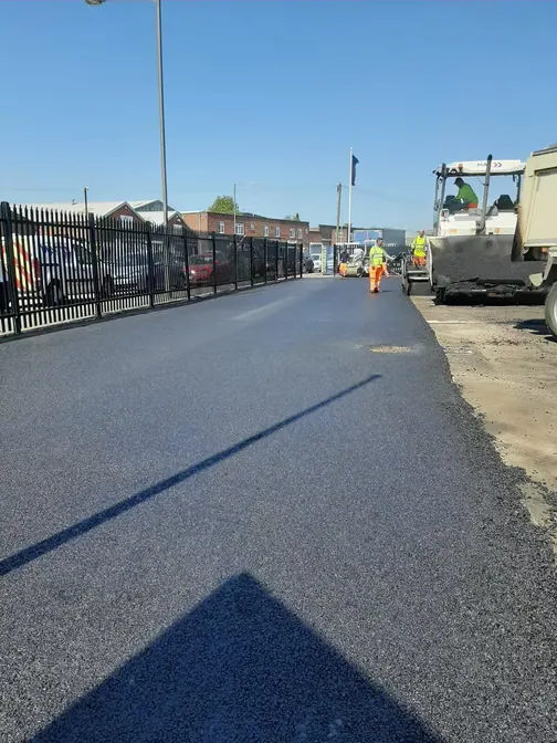 New tarmac path beside a fence