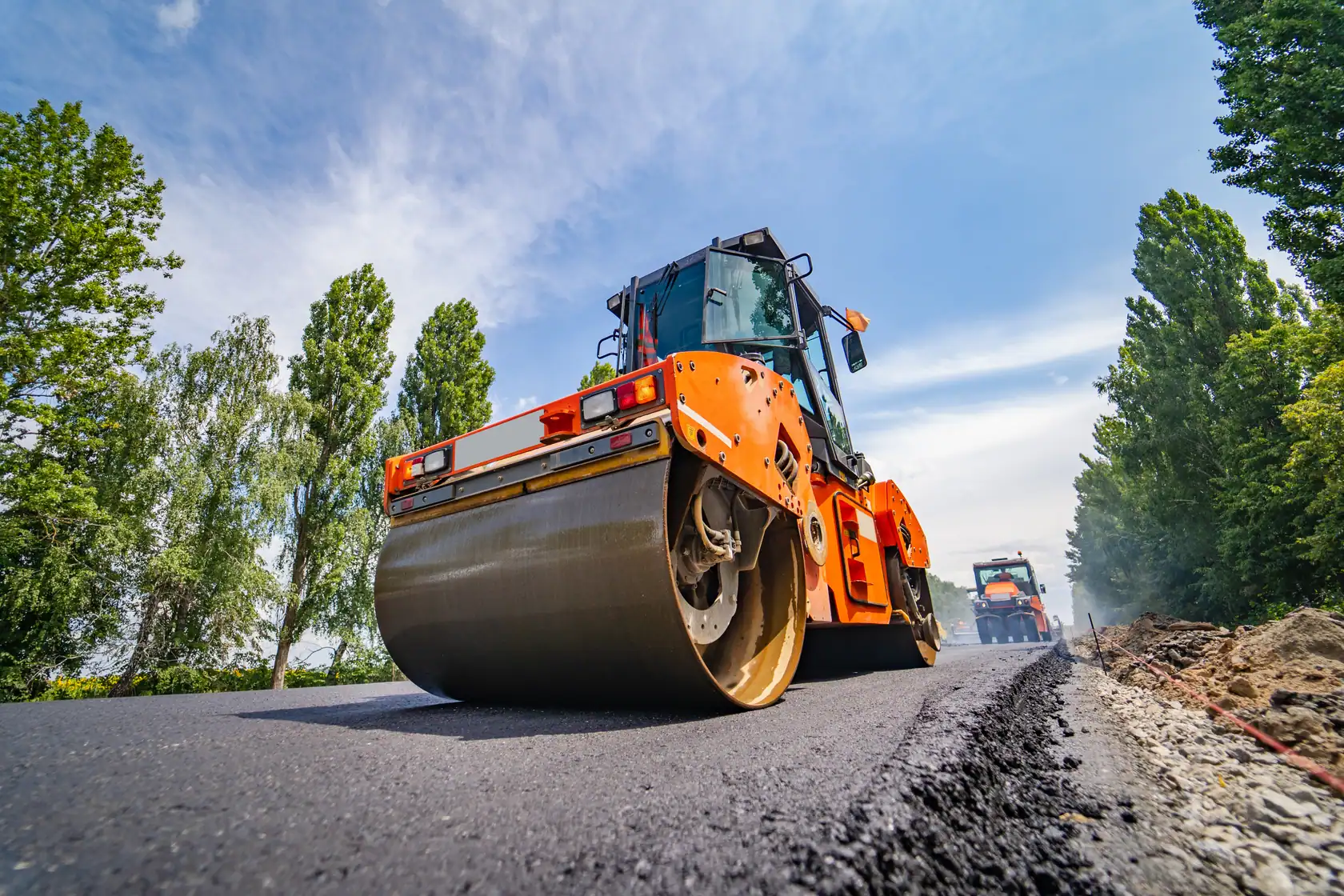 Roller compacting a freshly laid asphalt road